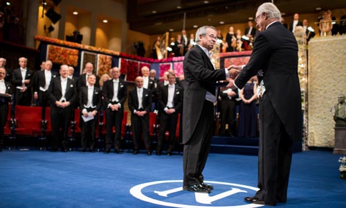 Arieh Warshel receiving his Nobel Prize from His Majesty King Carl XVI Gustaf of Sweden