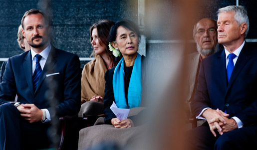 Aung San Suu Kyi in the first row, Crown Prince Haakon (left) and ThorbjÃ¸rn Jagland, Chairman of the Norwegian Nobel Committee (right), on stage during the celebration in downtown Oslo on 16 June 2012