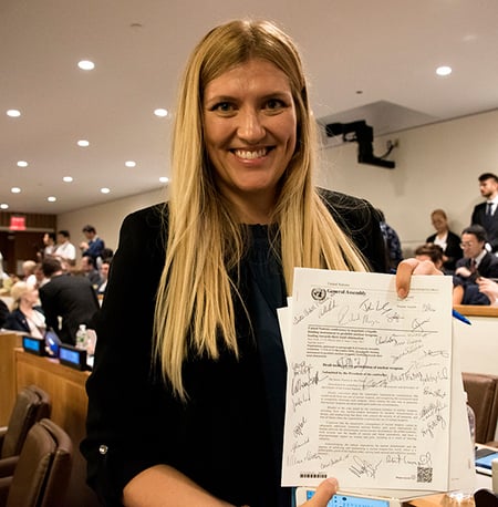Beatrice Fihn with the signed UN Treaty