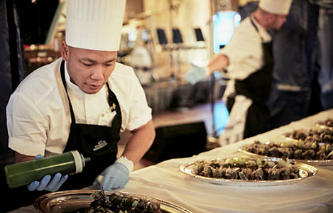 Chef Sayan Isaksson makes a last touch to the main course