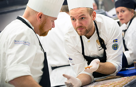 In the kitchen, the chefs prepare a three course dinner