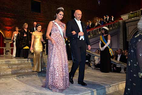 Sweden's Princess Madeleine and Stefan W. Hell proceed into the Blue Hall of the Stockholm City Hall for the Nobel Banquet.
