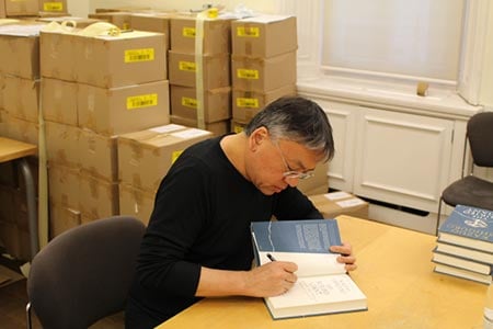 Kazuo Ishiguro signing books.