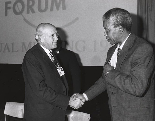 Nelson Mandela and Frederik de Klerk shake hands