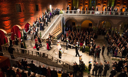 The Swedish Royal Family, the Nobel Laureates and other guests of honour proceed down the grand stairway