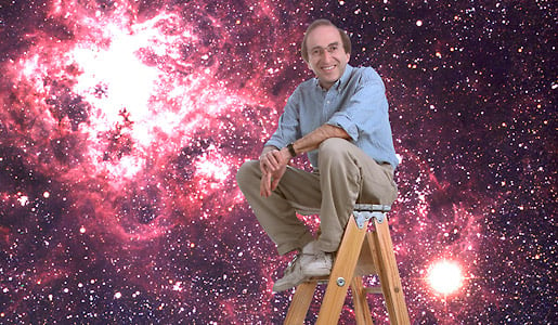 Saul Perlmutter pictured with a view of the supernova 1987a in the background