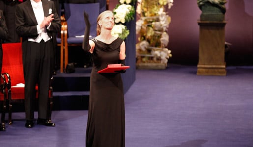 Mrs Claudia Steinman blows a kiss after receiving the Nobel Medal and Diploma on behalf of the late Professor Ralph M. Steinman