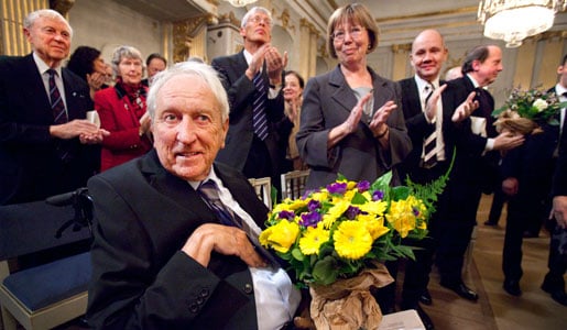 Tomas Tranströmer receives applause after the program at the Swedish Academy