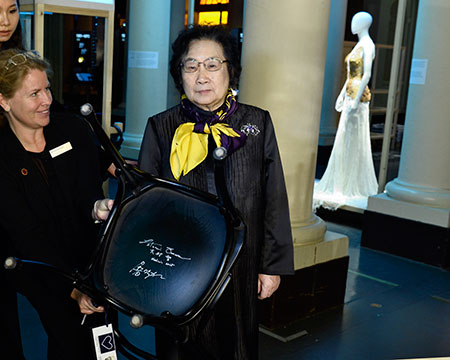 Nobel Laureate Youyou Tu and the autographed chair at the Nobel Museum in Stockholm.