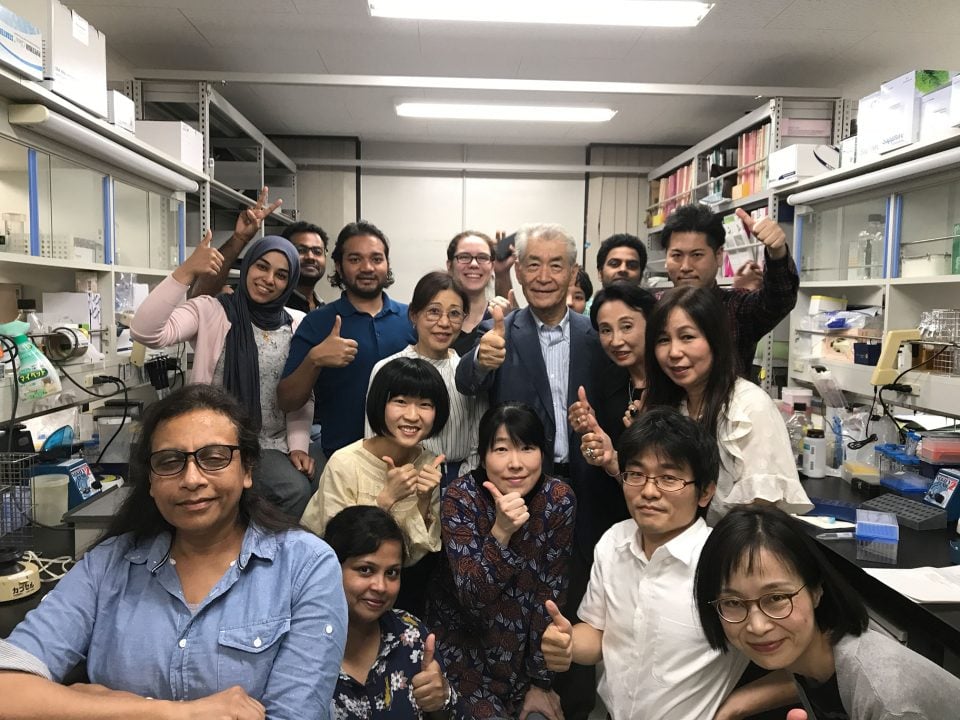 Nobel Prize laureate Tasuku Honjo, surrounded by his team at Kyoto University