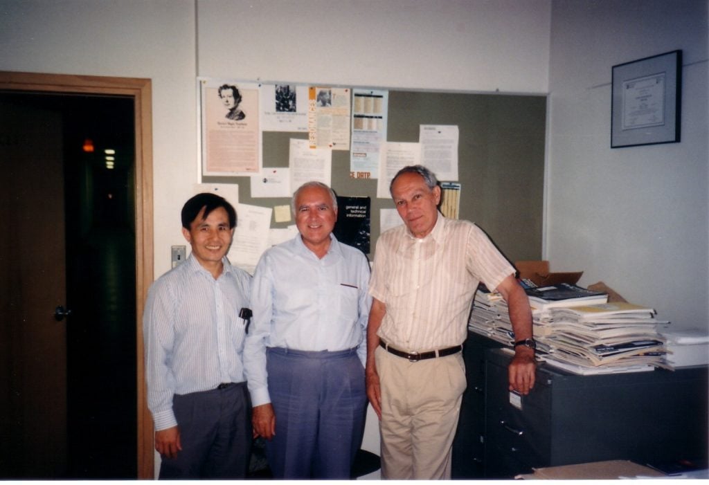 Three men in an office